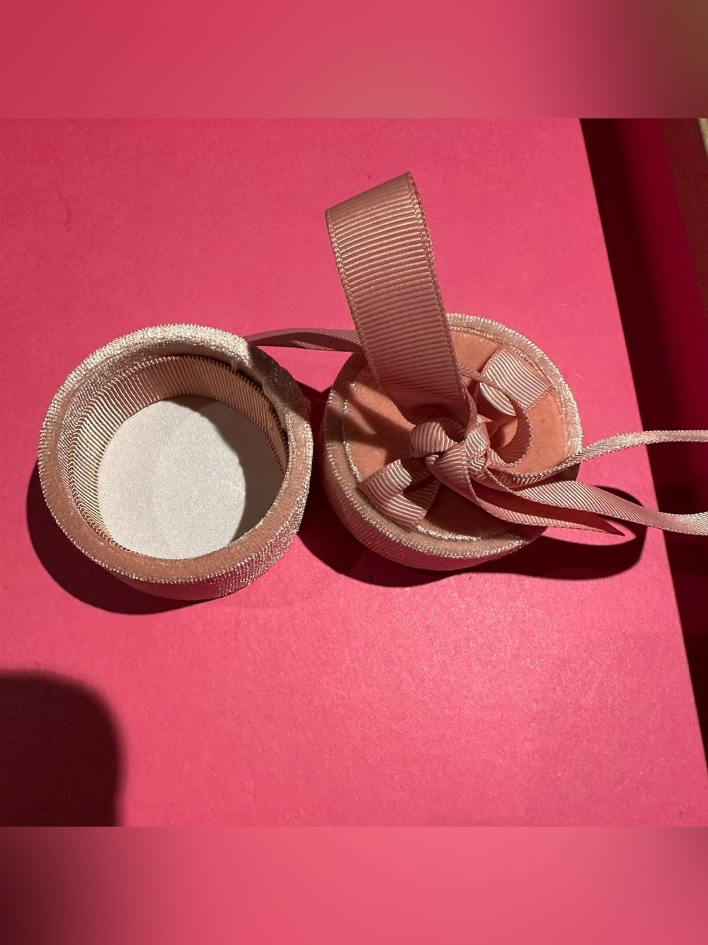 Velvet pink jewelry ribbon ring box.